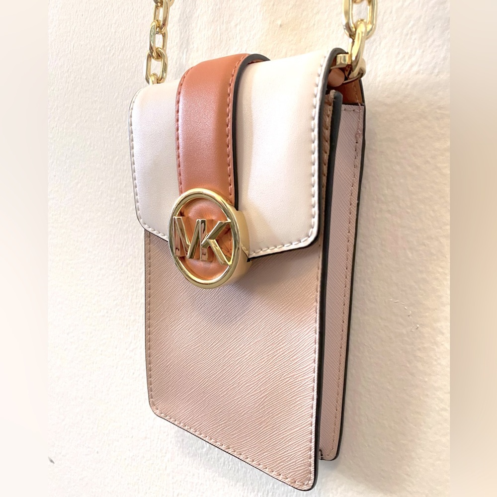 MK Michael Kors cell phone crossbody purse in shades of pink with gold hardware
